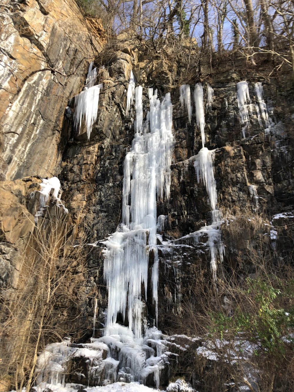 Grand icicles adorn a cliff.